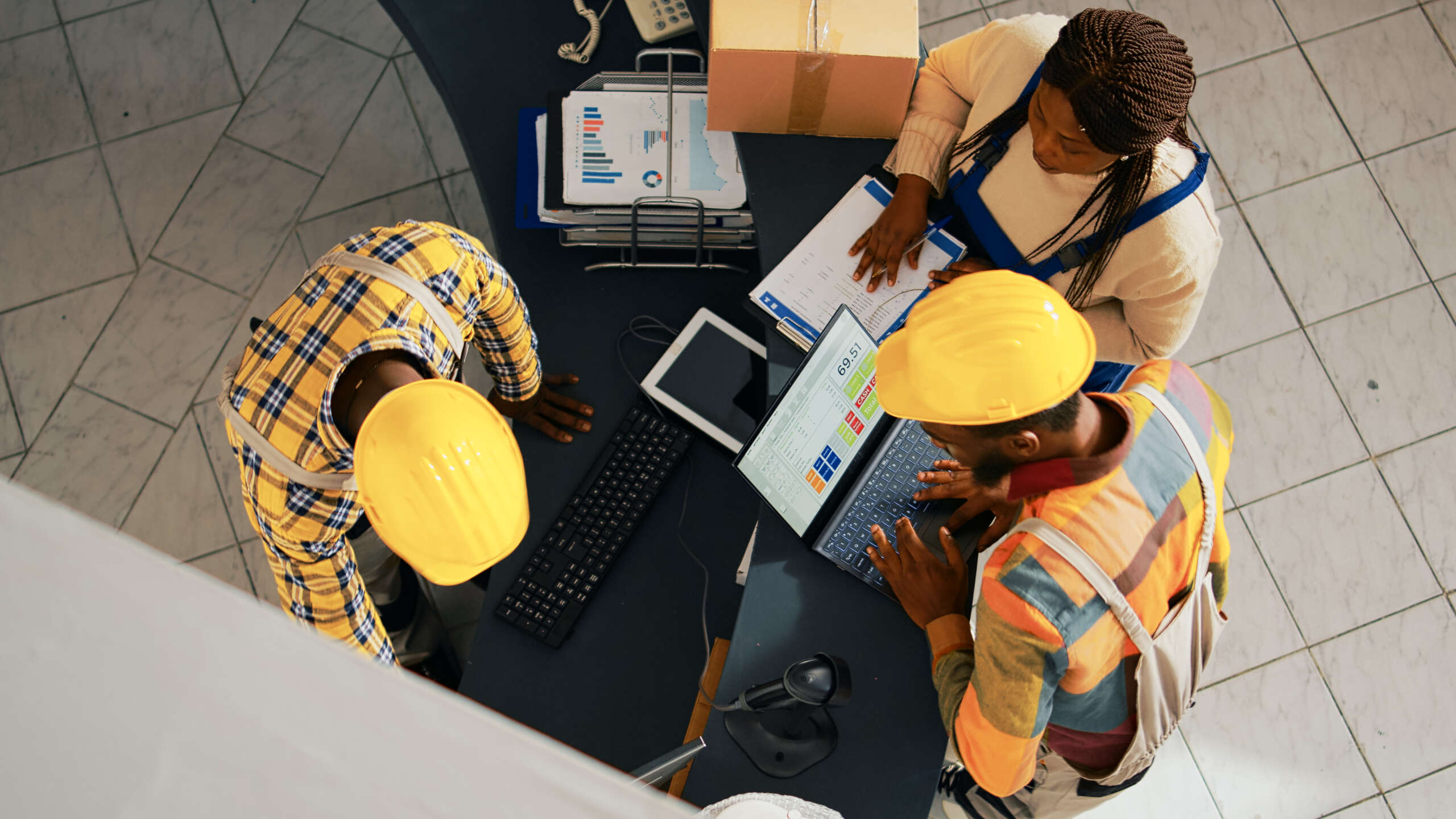 African american people looking at supplies list on pc